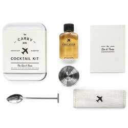 FOR THE TRAVELER The Carry on Cocktail Kit Gin & Tonic with carry on tin, recipe card, bar spoon, 1/2 ounce jigger, tonic syrup and linen coaster. SHOP